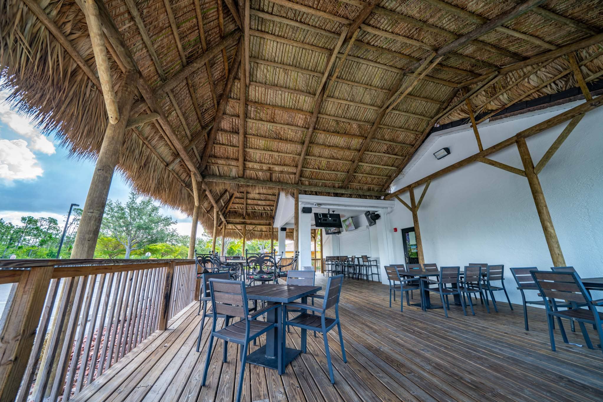 Large tiki covering a restaurant seating area